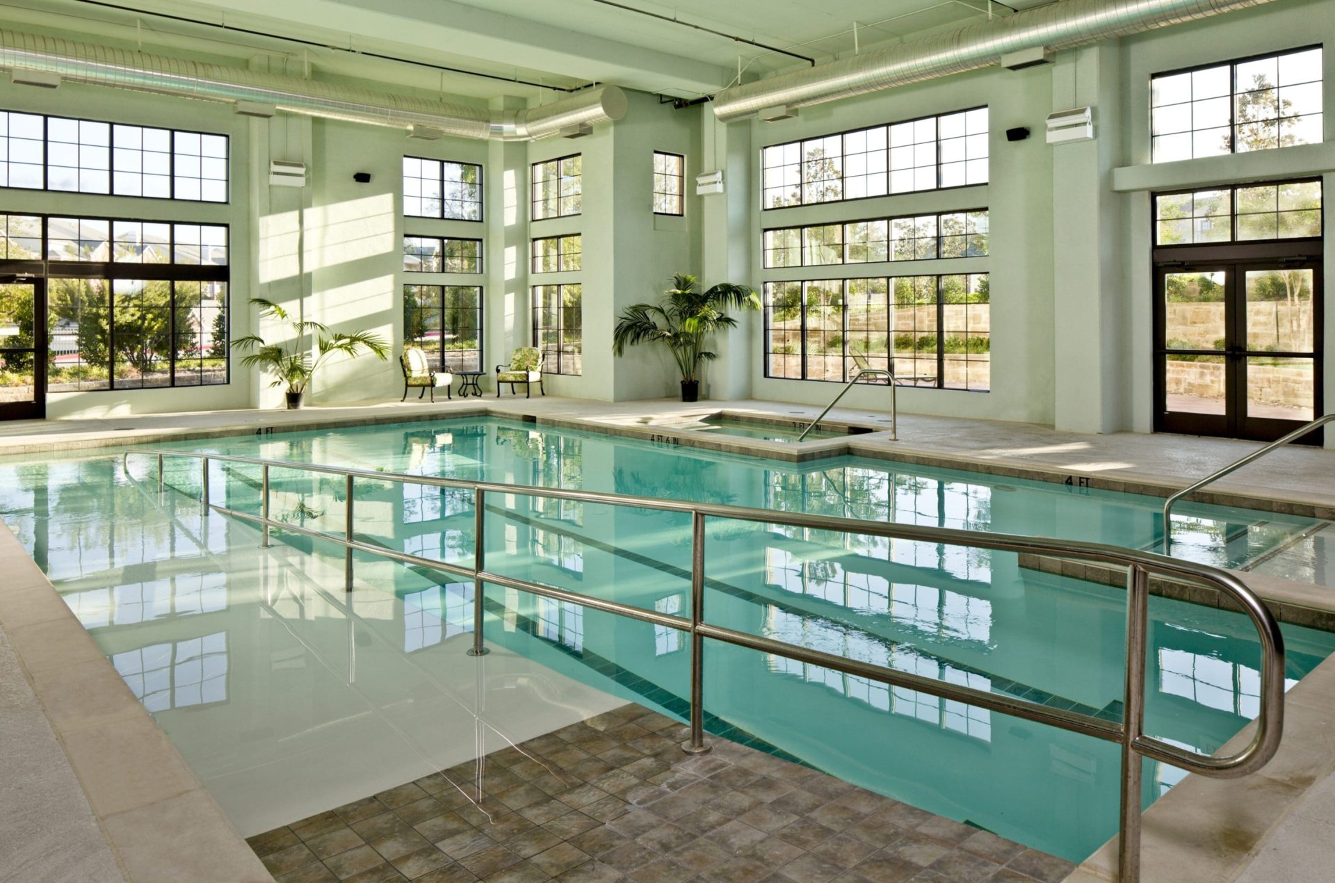 Indoor pool with access ramp at Tradition Senior Living - Prestonwood in Dallas, TX.